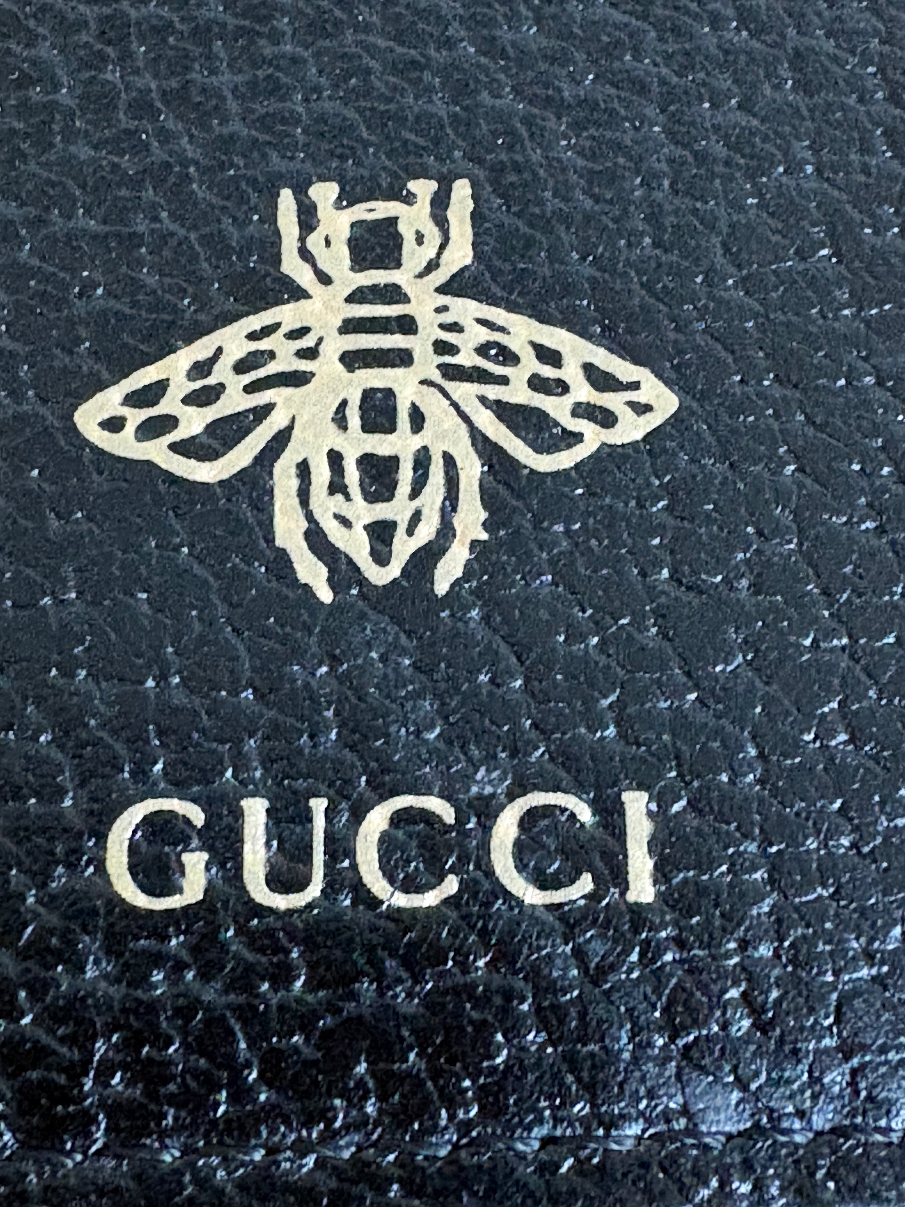 Gucci Bee & Star Embossed Leather Wristlet Clutch — Black