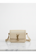 Elegant front view of Saint Laurent Solferino crossbody bag in cream leather with gold YSL monogram hardware